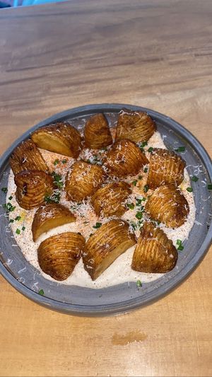 Potatoes with a “cheesy” sauce  at Real Vegetal in Medellin