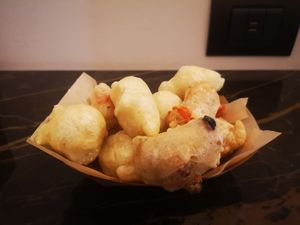 Pittule mix portion, plain and with olives, capers and tomato at Pittule - Freetfood in Lecce