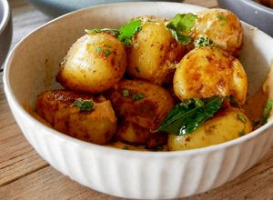 Smashed potatoes with curry mayo   at Otto Champagneria & Beer Hall in Wellington