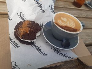 Dirty Chai Latte and vegan biscoff cookie sandwich at The Steamhouse in Redditch