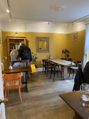 Library and art at Toucan Cafe in Minehead