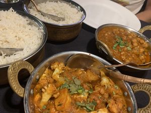 Cauliflower and potatoes in the front    at Maharaja Taste Of India in Kennewick