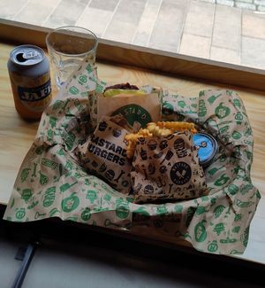 A meal with a burger, fries and no-chicken nuggets + aioli and soda at Bastard Burgers in Helsinki