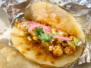 CAULIFLOWER STREET TACOS

Spicy cauliflower, Salsa Verde, smashed Avocado, crumbled Cheese, Pickled Onions and Cilantro on (3) white Corn Tortillas at Veg Head in Lansing
