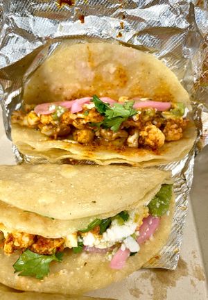 CAULIFLOWER STREET TACOS

Spicy cauliflower, Salsa Verde, smashed Avocado, crumbled Cheese, Pickled Onions and Cilantro on (3) white Corn Tortillas at Veg Head in Lansing