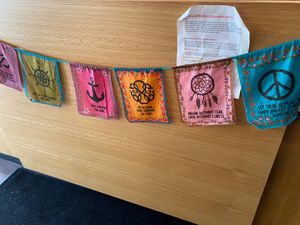 Prayer flags across front counter  at Zumi's Espresso in Ipswich