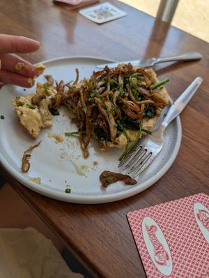 Hummus spinach mushroom olive oil toast...  This is half of it... at Neighbourhood Cafe in Lisbon