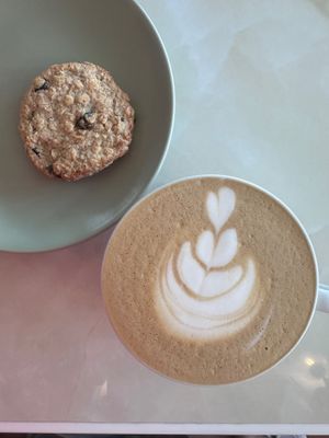 Cookie and oat milk cappuccino  at Unicorn Noms in Janabiyah