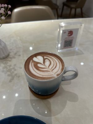 Coffee with oat milk at Unicorn Noms in Janabiyah