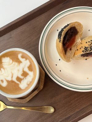 Flat white and red bean bun  at Cafe Vegu in Lewes