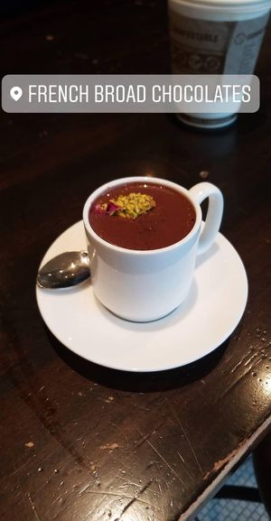 Buddha liquid truffle with pistachio rose garnish. at French Broad Chocolate Lounge in Asheville