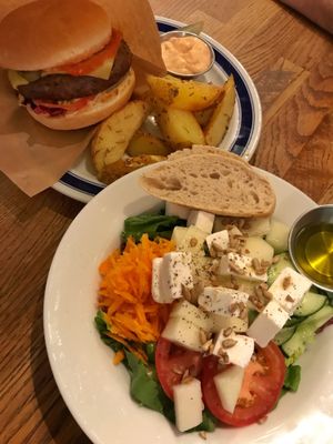 salad of the day with bread, and a burger  at Kafe 44 in Stockholm