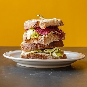 De Red Kimchi - A sourdough sandwich with house-made red cabbage kimchi on a layer of hummus and lettuce.  at Wildflower Canteen in Leiden