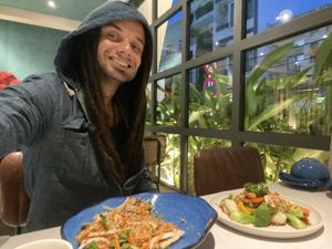 Me enjoying the Squeezed Mushroom Stem Salad and the Five-Color Veggies with Mushroom Sauce!  at SHAKTI in Nha Trang
