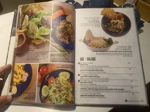 The Shakti menu page containing the Squeezed Mushroom Stem Salad  at SHAKTI in Nha Trang