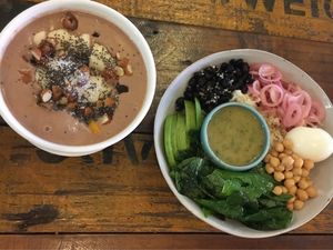 Chocolate smoothie bowl and Popeye salad bowl at Artillery Arts Cafe in Phnom Penh