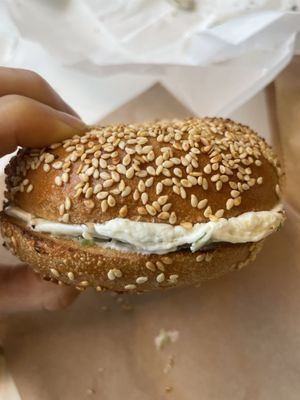 Sesame bagel with scallion cream cheese  at Ben & Esther's Vegan Jewish Deli in Seattle