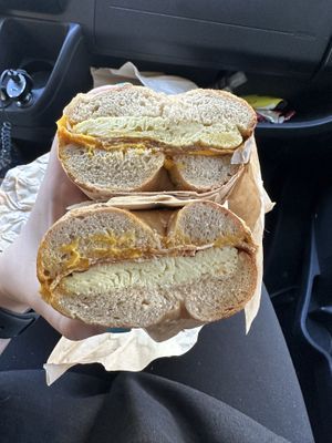 Bacon egg and cheese on a toasted salt bagel  at Ben & Esther's Vegan Jewish Deli in Seattle