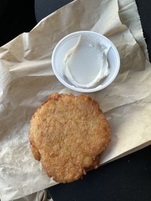 Potato latke with sour cream  at Ben & Esther's Vegan Jewish Deli in Seattle