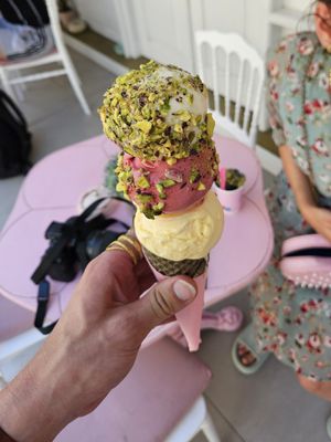 Pineapple, cherry, mandarine in cone with pistachio at Dream Cream in Rhodes