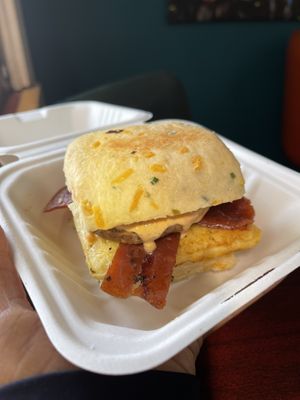 Sausage Egg Biscuit (I asked to omit cheese but the biscuit is made with cheese). I added bacon    at Soulshine Vegan Cafe in Indianapolis
