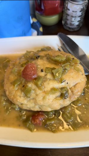 Vegan Breakfast Bunzy! It is stuffed with potatoes, tofu scramble, & vegan sausage. I had it smothered in green chili. They also have VioLife cheese available!   at Bunzy's & Booze in Colorado Springs