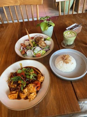 Pumpkin nugget salaf, matcha with oat milk, tofu in spicy sauce, rice😄 at Over the Moon Cafe in Sanur