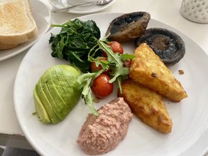 Vegan fry - spinach, avocado, hummus, roasted cherry tomatoes, hash browns, and mushrooms  at Bari Café in Cahersiveen