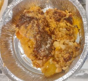 Slice of peach dump cake (a twist on peach cobbler)  at Sofull Vegan in Hemet