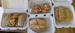 The entire spread! Chimi, twisted burrito, mofongitos de carne, mac and beef empanada, and yaroa empanada   at Next Stop Vegan in Brooklyn