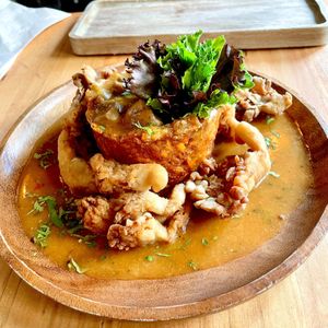 Crispy Monfungo - green plantain boat stuffed with cremini, peppers, onions and served with fried oyster mushrooms   at Next Stop Vegan in Brooklyn