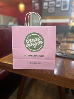 cute bags for to-go food  at Neat Burger - Dubai Mall in Dubai