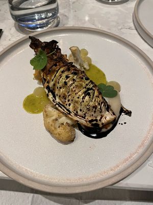 Fifth course of the vegan menu: Charred Hispi Cabbage, Soy Glaze, Cauliflower, Choucroute, Apple Gel & Mustard Dressing  at Six by Nico in Glasgow