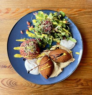Vegan Bulgur Spinach Balls w Red Beet Couscous and Tahin Saucee  at Unser Cafe in Berlin