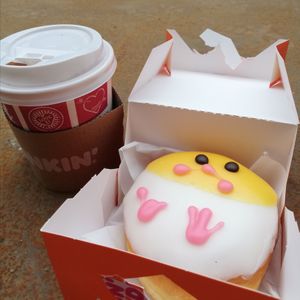 Spring donut of a chicklet and a hot cocoa with plantmilk at Dunkin' - Herestraat in Groningen