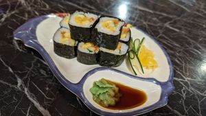 Banana maki. The side dish is papaya, not ginger! Pretty cool! at Qi Fu Healthy Park Vegetarian in Ipoh