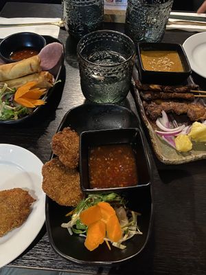 Cabbage rolls (centre), spring rolls (left), lions mane satay skewers (right)  at Soul Vegan in Edinburgh