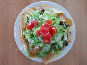 Nachos supreme, piled so high! at Itality Plant Based Foods in Albuquerque