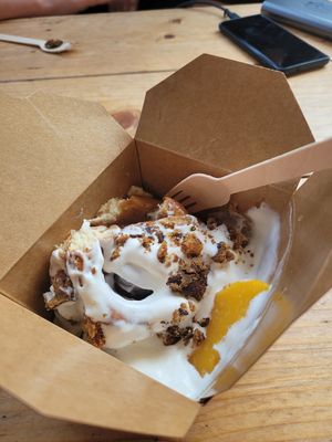 Cinnamon bun with oat cream, fruit and biscuit crumbles at Canteen at The Eco Park in Porthtowan