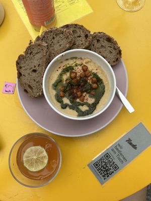 Delicious hummus with bread!   at Nude Zurich in Zurich