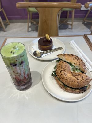 Mushroom bagel, orange and chocolate cake, and cherry matcha  at Bloom Cafe & Cakery in New Delhi