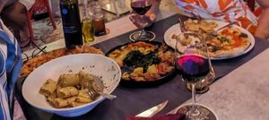 Giant macaroni, vegetable pizza and side platter of vegetables (and vegan red wine) at  Al Circo Ristorante Italiano in Gran Canaria