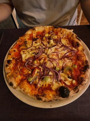 Pizza with vegan mozzarella and veggies  at  Al Circo Ristorante Italiano in Gran Canaria