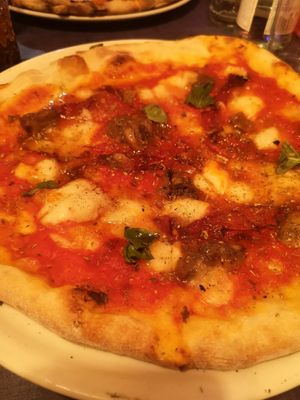 Pizza with rice milk mozzarella, capers, basil and chilli at  Al Circo Ristorante Italiano in Gran Canaria