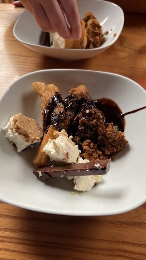 Vegan KitKat lemon cheesecake, apple crumble and curroes and chocolate sauce   at The Barn Pub & Restaurant in Rugby