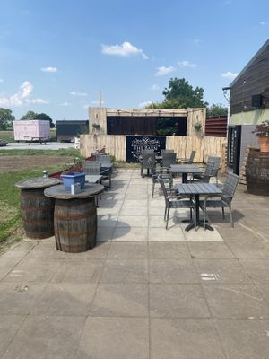 Outdoor seating (I didn't get a picture but there is a lot more outdoor seating in the field to the left of this picture)  at The Barn Pub & Restaurant in Rugby