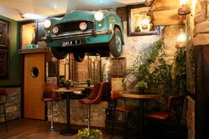 Hindustan Ambassdor car mounted on the wall at Donald Watson's Vegan Bar in Leicester