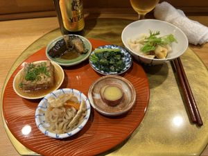 Obanzai (Simmered Deep Fried Tofu, Braised Eggplant, Simmered Radish Strips, Japanese Mustard Spinach, Candied Sweet Potato) - 7/10, Dumplings - 8/10  at Vegan Izakaya NIJIYA 虹屋 in Kyoto