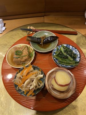 Obanzai course: deep fried tofu, braised eggplant, simmered radish strips, Japanese mustard spinach with sesame, and candied sweet potato.   at Vegan Izakaya NIJIYA 虹屋 in Kyoto