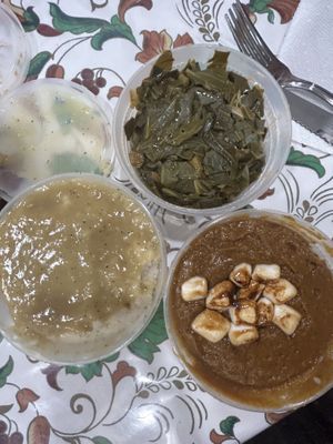 Mashed potatoes with gravy, collard greens, and candied sweet potatoes  at Colossal Vegan - Cloud Kitchen in Belleville